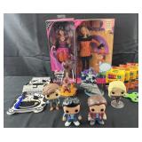 Group of Barbie dolls, Funko Pop figures, crayons