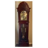 Grandfather clock, brass face with Roman numeral