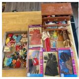 Collection of vintage Barbie clothing and wooden