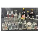 Collection of bottles and apothecary jar, milk,