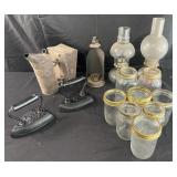 Group of oil lamps, irons, jars and more