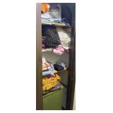Contents of hall closet, vintage hamper, quilts,