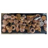 Collection of bunt pans, fish, roosters, lobsters