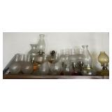 Group of oil lamps and glass shades