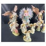 Group of angelic figures and candleholders,
