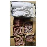 Collection of coat hangers, mattress cover and