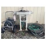 Group of hoses, hose reel and garden sink