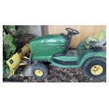 John Deere lawn tractor with blade attachment, no
