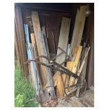 Group of primitives, yard tools and lumber