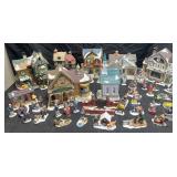 Collection of porcelain houses and figures, some