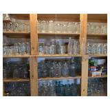 Collection of canning jars, soda bottles, lids