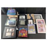 Group of picture frames and books