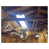Group of premium lumber in loft and on table