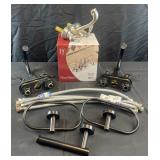 3 bathroom faucets, towel holders and hoses
