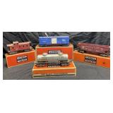 4 vintage Lionel train cars with original boxes