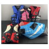 5 life vests and 'Zipper' round tube towable