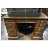 Sligh kneehole pedestal desk with gold tooled