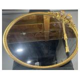 Vintage Hollywood Regency-style ornate gold round