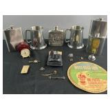 Group of flasks, pewter tankards, tie clips and