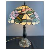 Cast metal table lamp with leaded glass shade,
