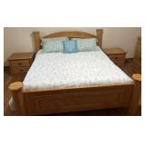 California King oak bed with pair of nightstands,