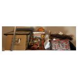 Group of fall decor, wreaths, pumpkins, doormat