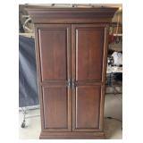 Mahogany bar cabinet with lighted interior, wine