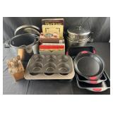 Group of kitchenware, pots, baking dishes, knife