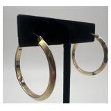 Pair of 14k gold earrings, 1.49 dwt, both are