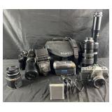 Group of vintage cameras, flashes, telescopic