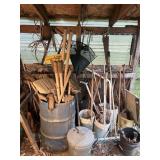 Pictured items along lean to wall, shovels,