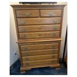 Stacked oak chest of drawers with brass pulls,