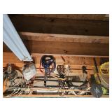 Contents of wall above door: lasso, long handled