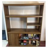 Entertainment center with collection of VHS,
