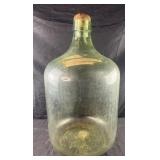 Antique green glass demijohn or carboy bottle