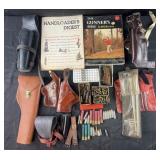 Group of leather holsters, ammunition, books,