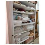Linens, Quilts & Blankets on Shelving Unit