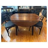 Drop Leaf Table with Black Wicker Chairs