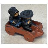 Cast-iron miniature wagon with Amish children