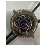 Bolo ties, one with stone and one with Ford key