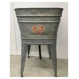 Wheeling galvanized wash tub on stand