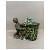 Boy pushing cart, candy dish