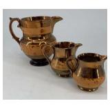(3) Copper lusterware pitchers, yellow band, 5ï¿½,