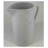 Contemporary white ceramic pitcher, 7 Â½ inches.