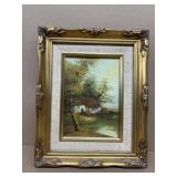 Painting on board of cottage signed Evan