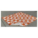 Orange and white quilt