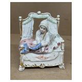 Porcelain trinket box little girl sitting on b