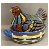 Terra-cotta hen on nest