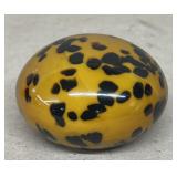 Orange and black paperweight 3 inches round