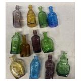 (12) 1970 colored medicine bottles